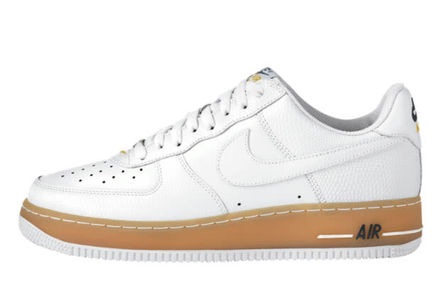 white nike with gold tick