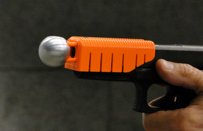 A Handgun Attachment Aims to Save Lives by Making Bullets Non-Lethal