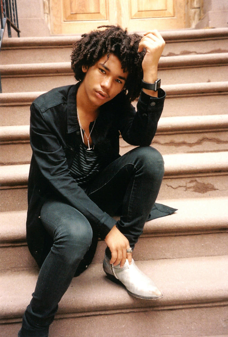 Luka Sabbat wears a black t-shirt, black pants, outside Rick Owens