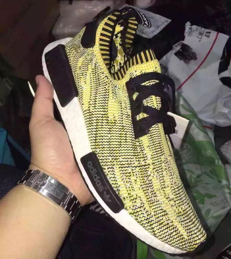 yellow and black nmds