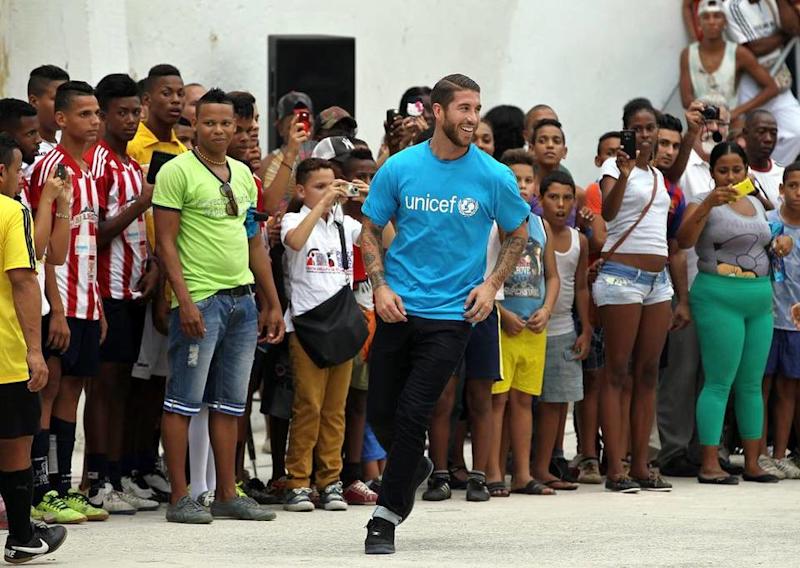 Ramos has been playing football with the local children.