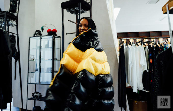 Aleali May trying on a coat at H. Lorenzo in West Hollywood, Calif.