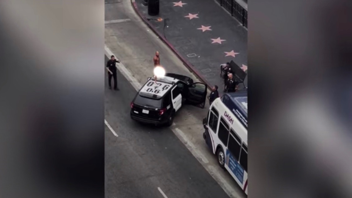 Man Filmed Dancing Naked Atop Police Car Hit With Misdemeanor Complex