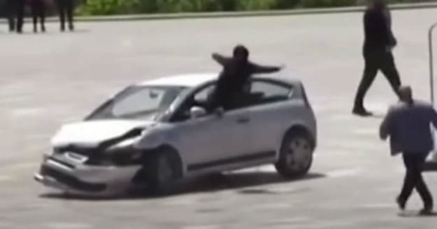 Video Shows Man Jumping Feet First Through Open Car Window to Stop ...