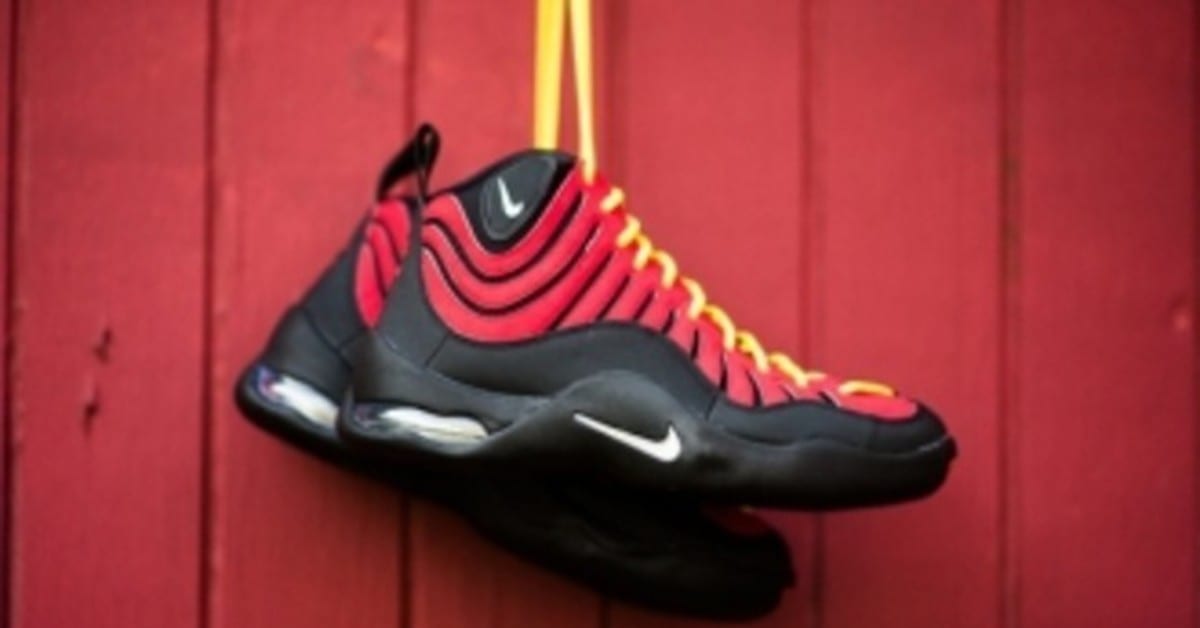 Red black and yellow nike top
