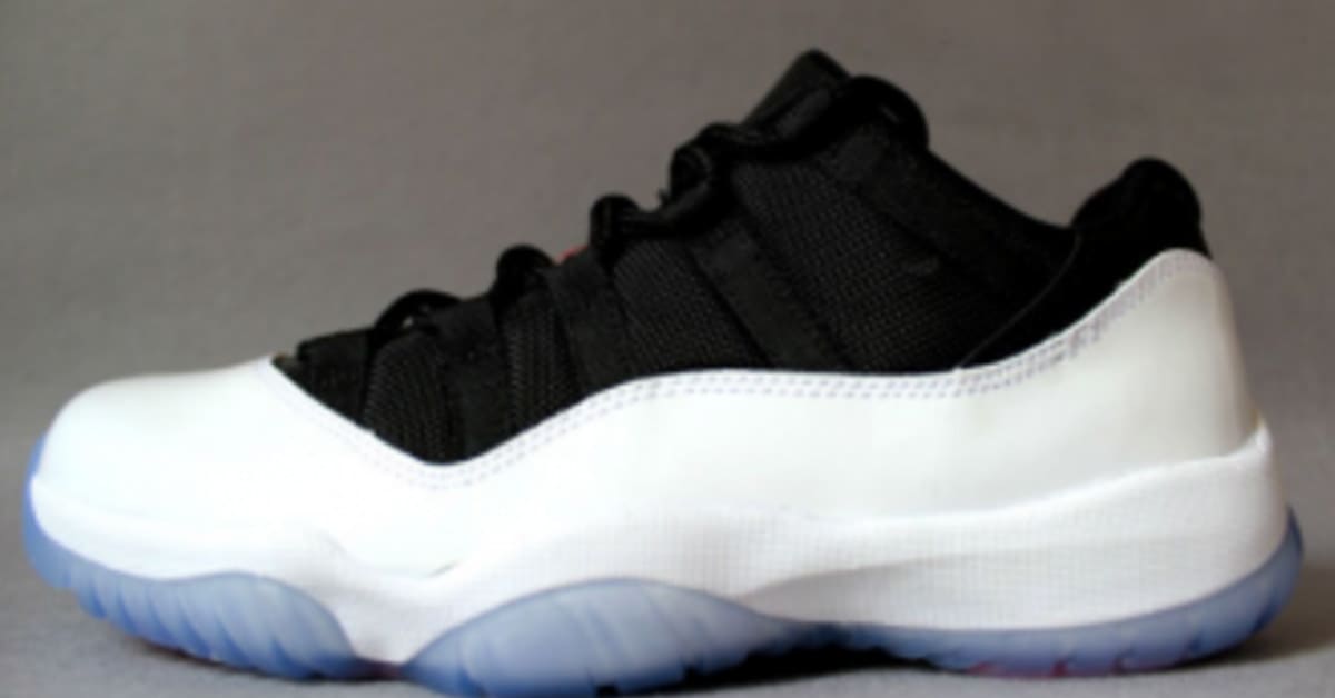 Low top black and white 11s sales