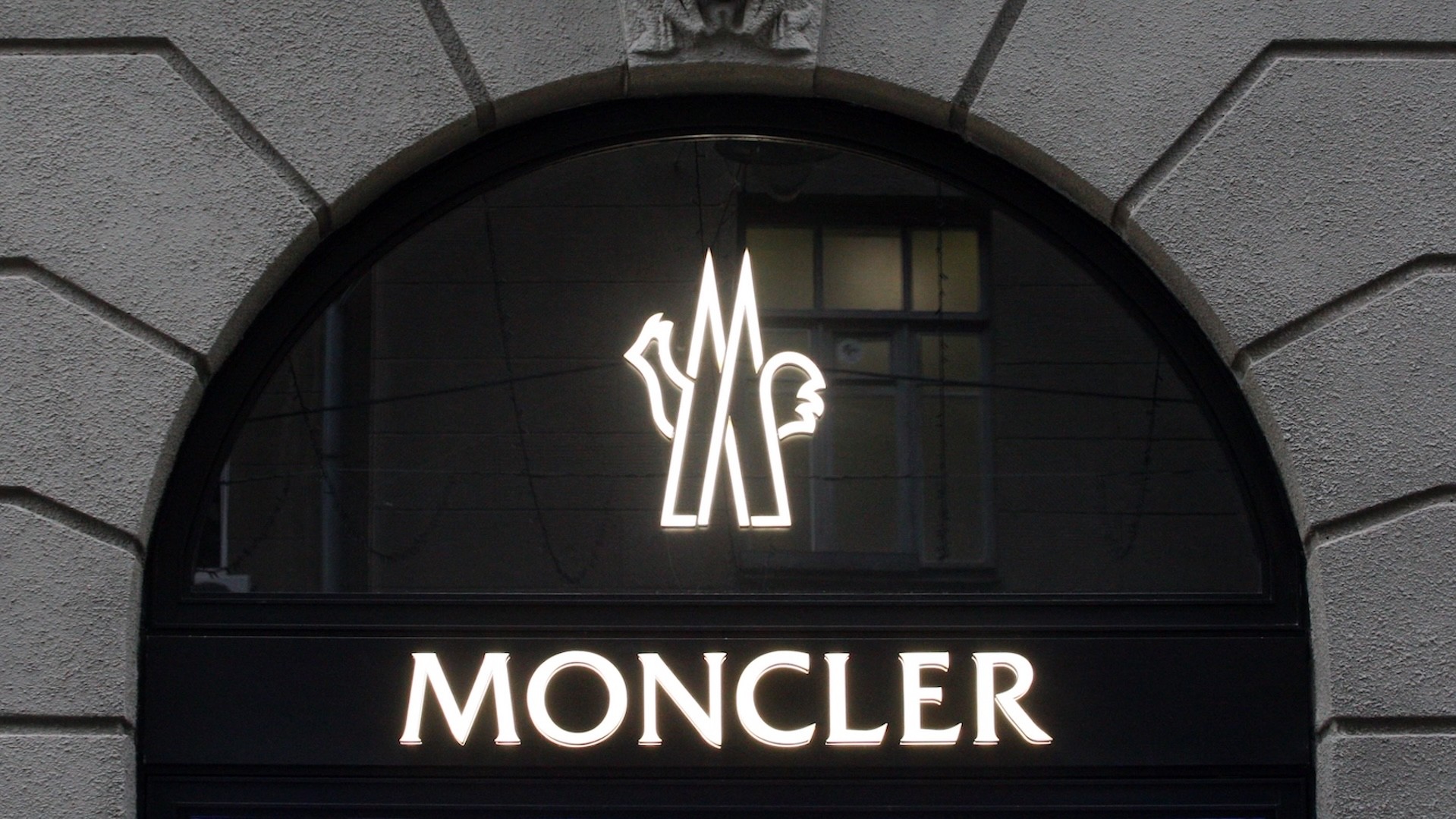 Moncler logo seen over the entrance to their brand store in Kiev.