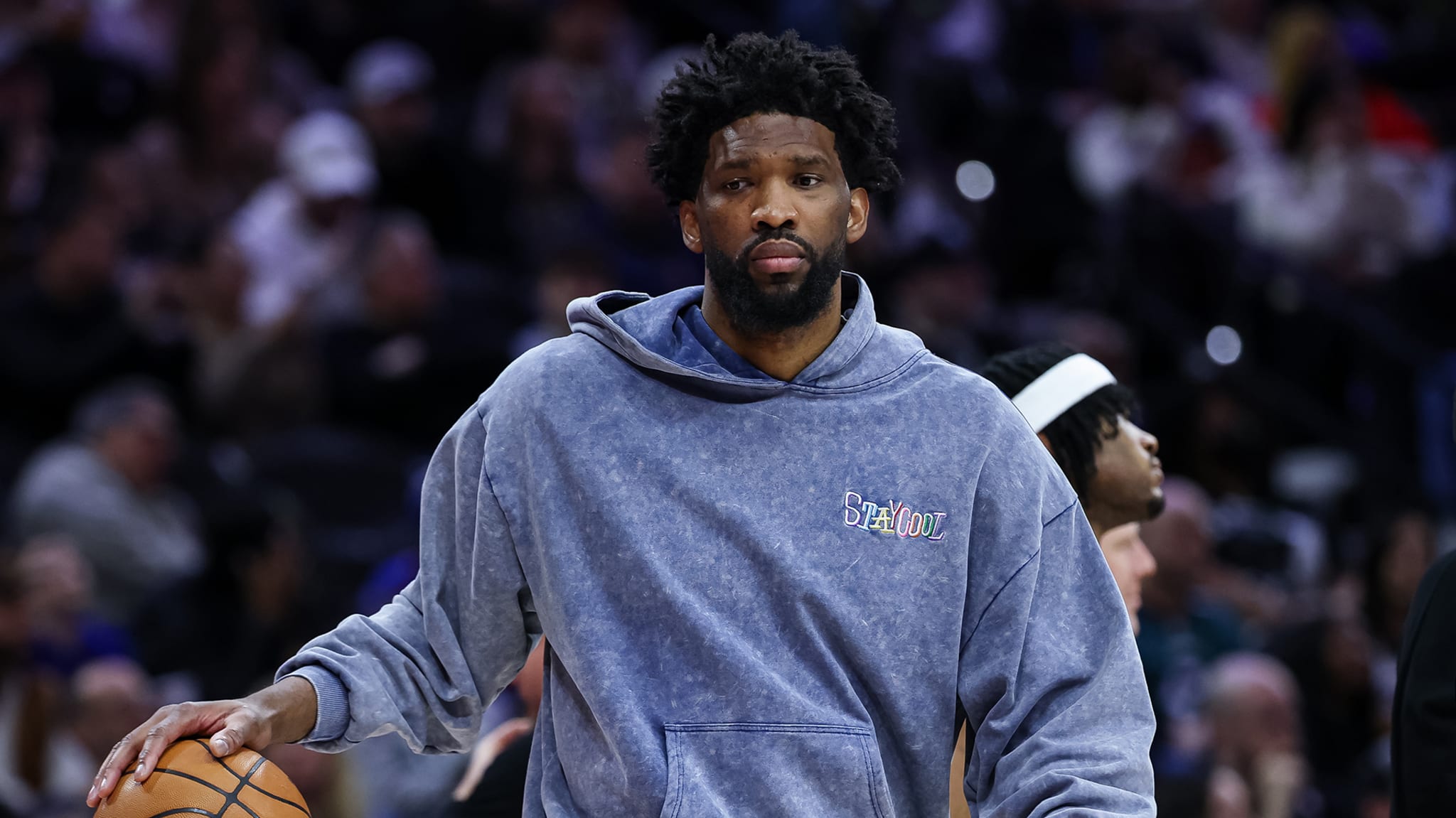 Joel Embiid #21 of the Philadelphia 76ers dribbles a ball.