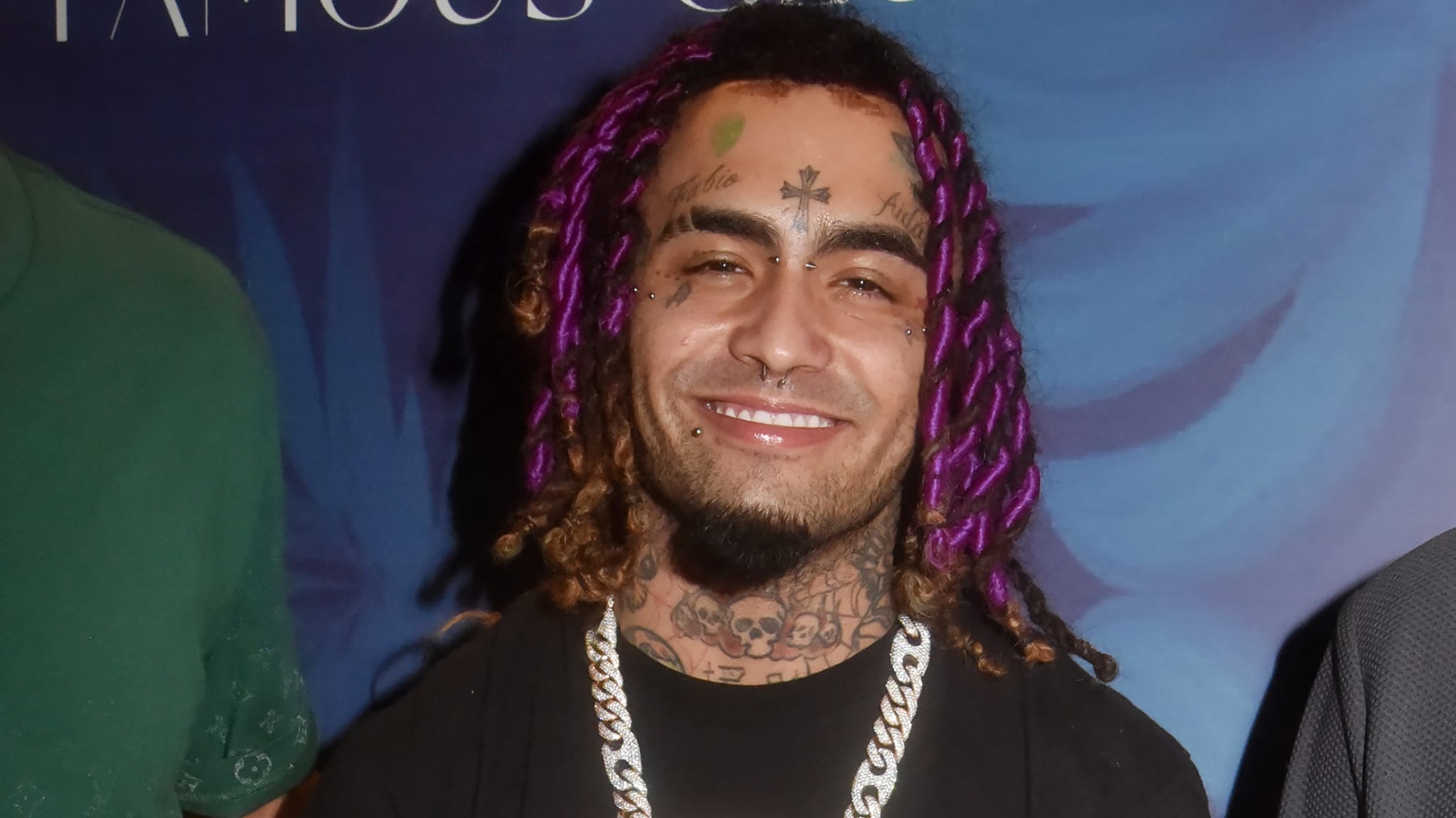 Rapper Lil Pump wearing a black T-shirt and silver chain.