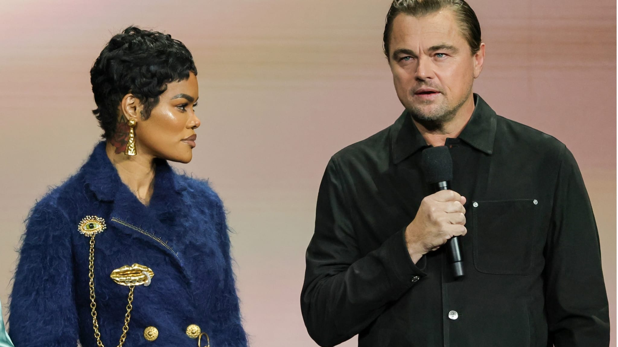 Teyana Taylor (L) and Leonardo DiCaprio promote the upcoming film "One Battle After Another" at the Warner Bros. Pictures presentation during CinemaCon, the official convention of Cinema United, at The Colosseum at Caesars Palace on April 01, 2025 in Las Vegas, Nevada.