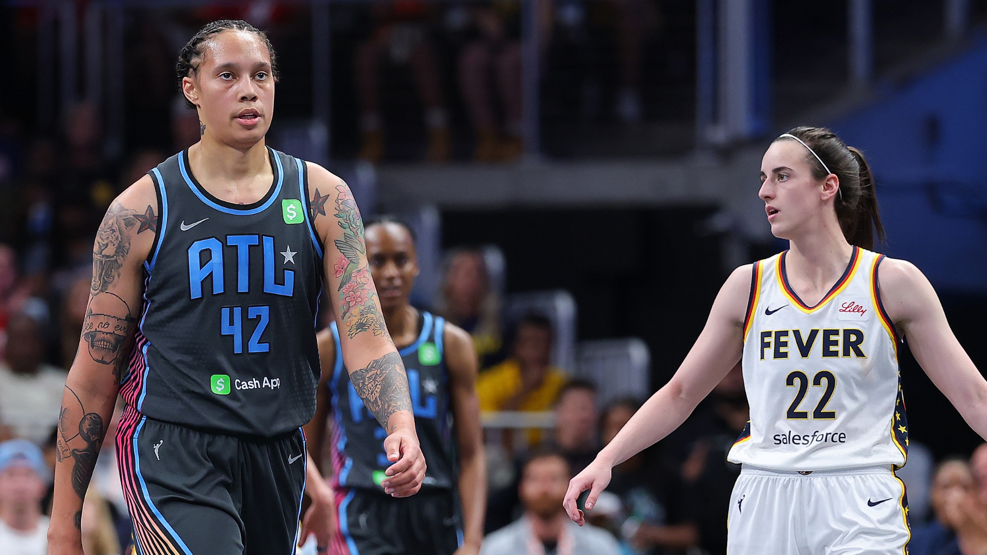 A WNBA game featuring players from the Atlanta Dream and Indiana Fever, with one player wearing "ATL" jersey number 42.