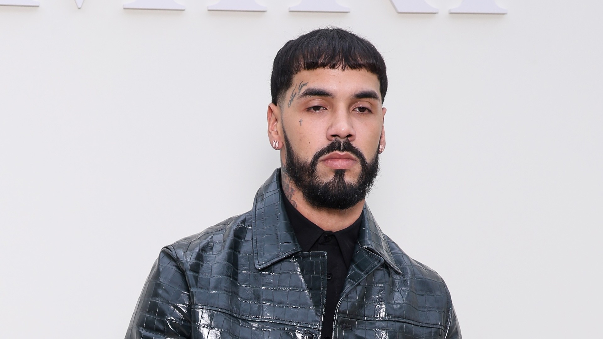 Anuel AA attends the Amiri Menswear Spring/Summer 2025 show.