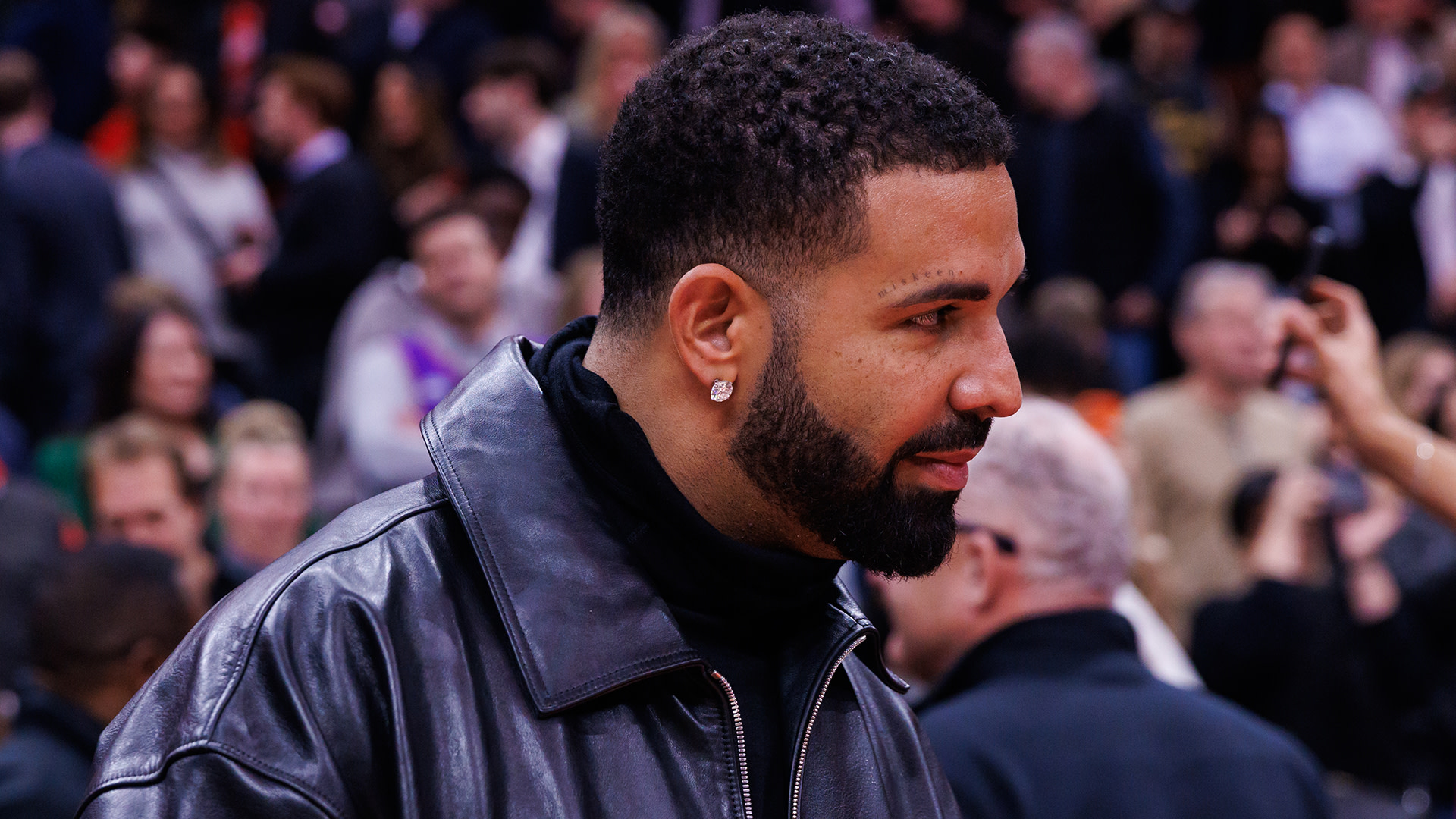 Drake Spotted in Vintage Packers Jacket While Shooting Video