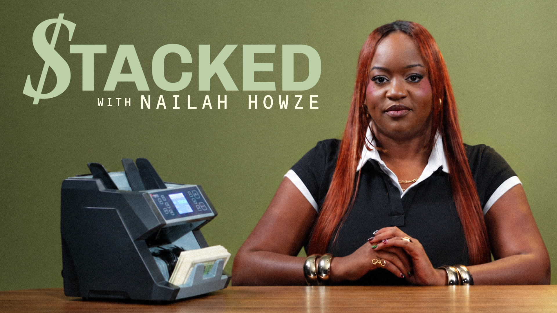 {"title":"Stacked with Nailah Howze","description":"Nailah Howze sitting at a table with a money counter, text overlayed."}