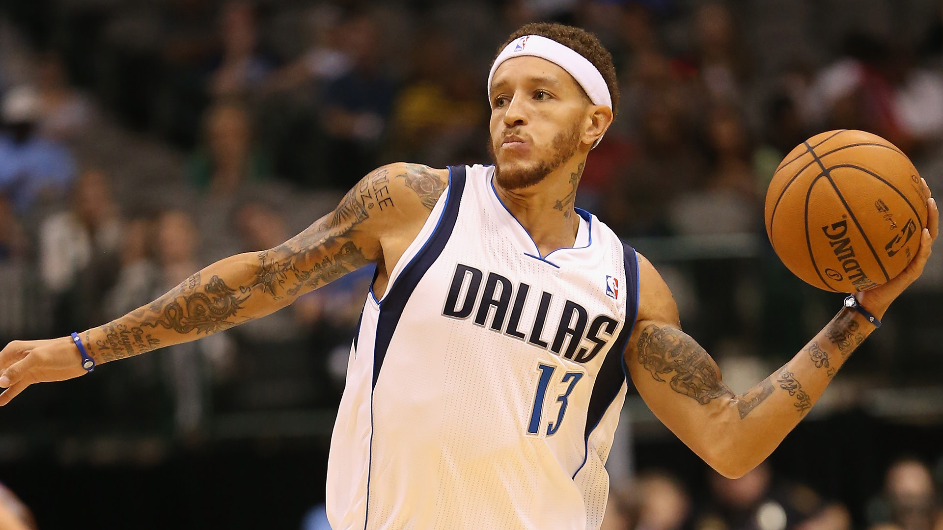 Delonte West #13 of the Dallas Mavericks passes the ball against the Phoenix Suns during a preseason game at American Airlines Center on October 17, 2012 in Dallas, Texas.