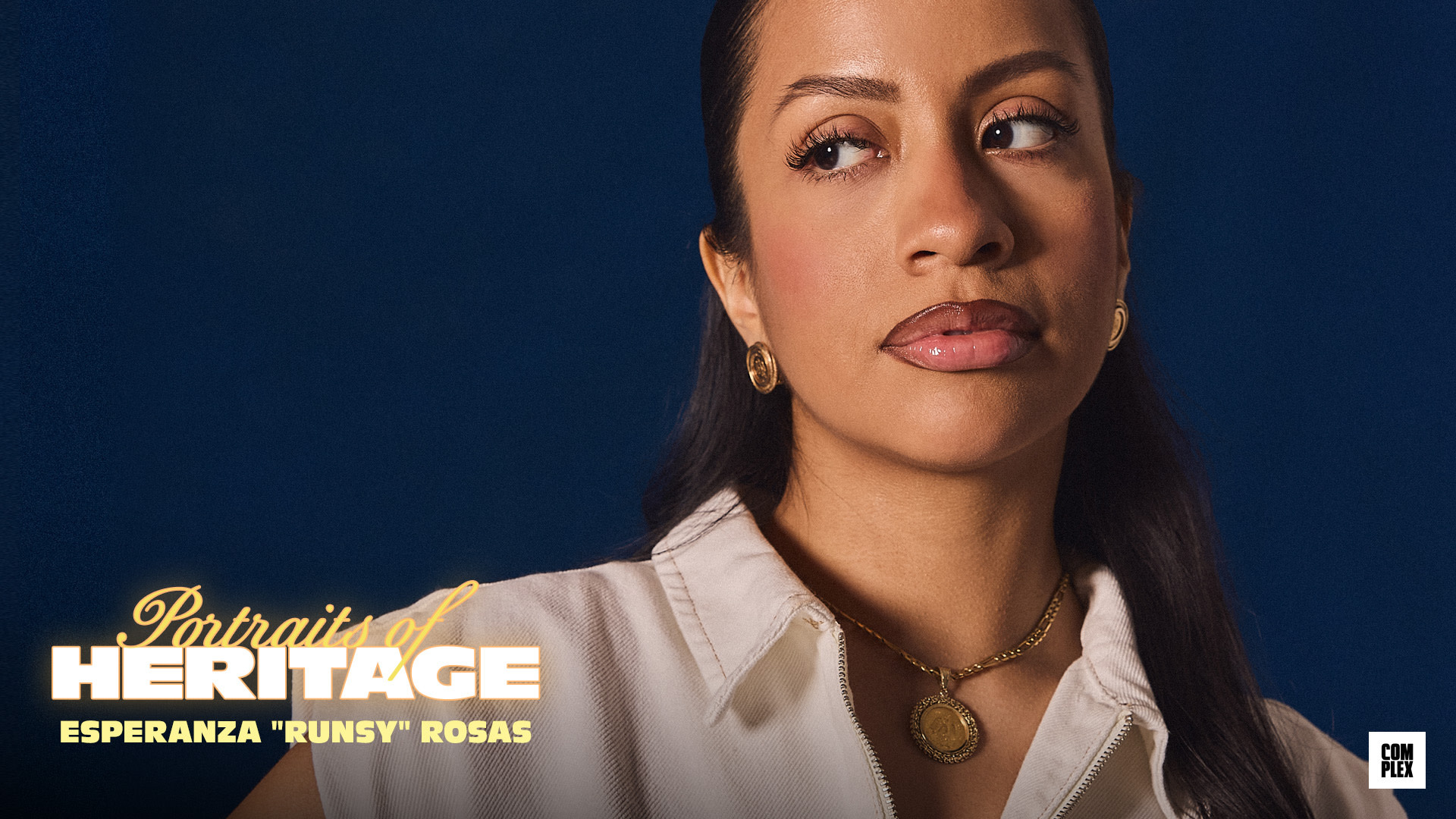 {"Esperanza 'Runsy' Rosas is featured in a promotional image for 'Portraits of Heritage,' wearing gold jewelry and a white top."}