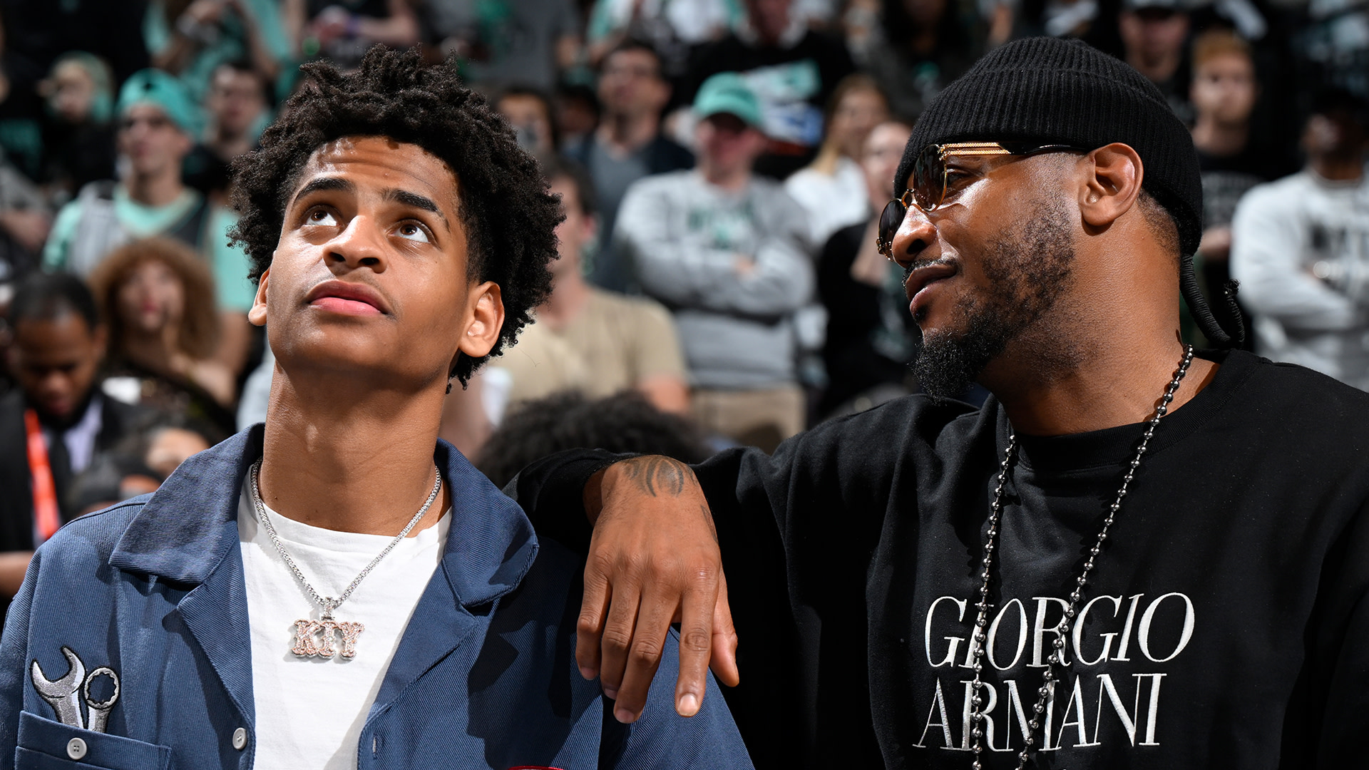 Kiyan Anthony and Carmelo Anthony smile during the game between the Minnesota Lynx and the New York Liberty during Game 5 of the WNBA Finals in October 2024.