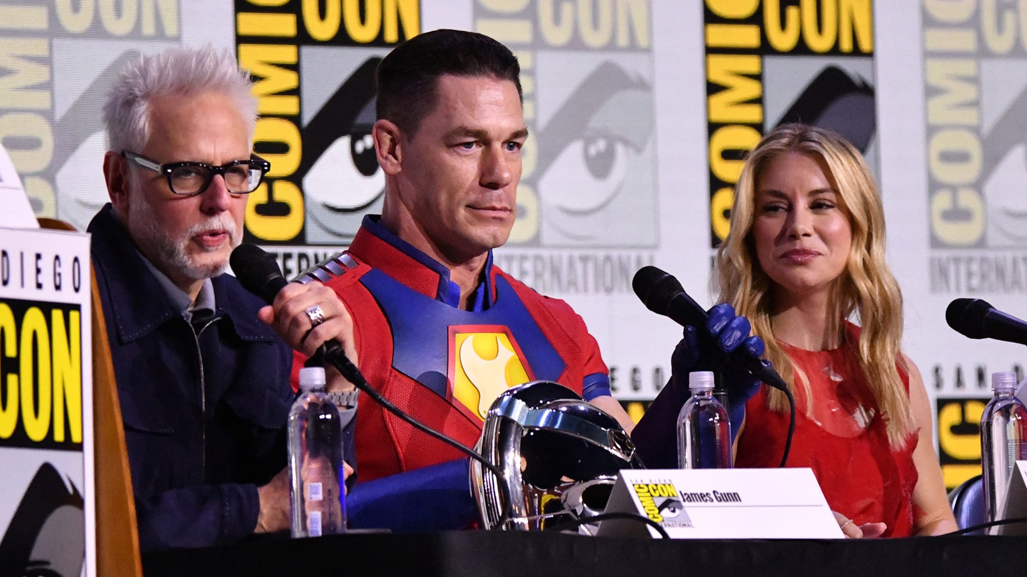 Director James Gunn, alongside actors John Cena and Jennifer Holland, during San Diego Comic-Con 2025.