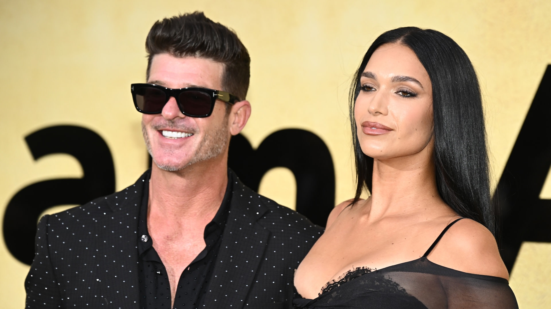(L-R) Robin Thicke and April Love Geary.