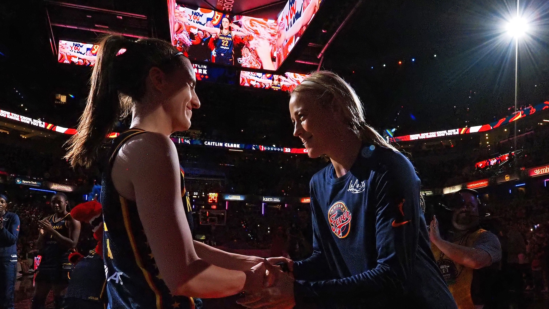 Caitlin Clark and Sophie Cunningham pose for a photo before the game.