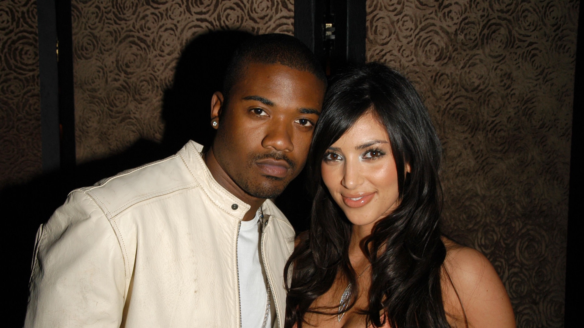 Ray J and Kim Kardashian pose for photo together at a fashion show in 2006.