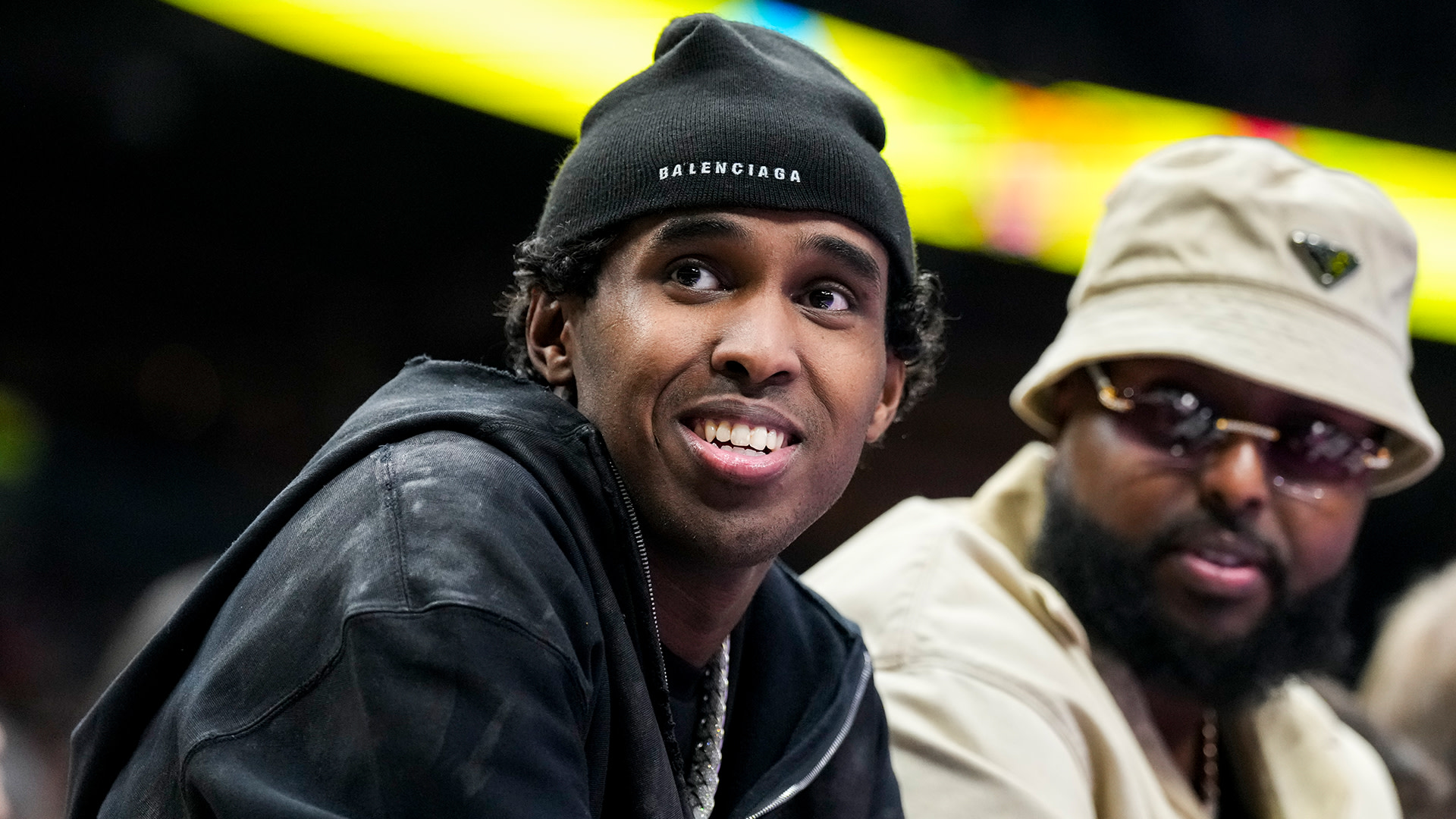 Local rapper Top5 looks on from the courtside at a NBA between the Indiana Pacers and Toronto Raptors.