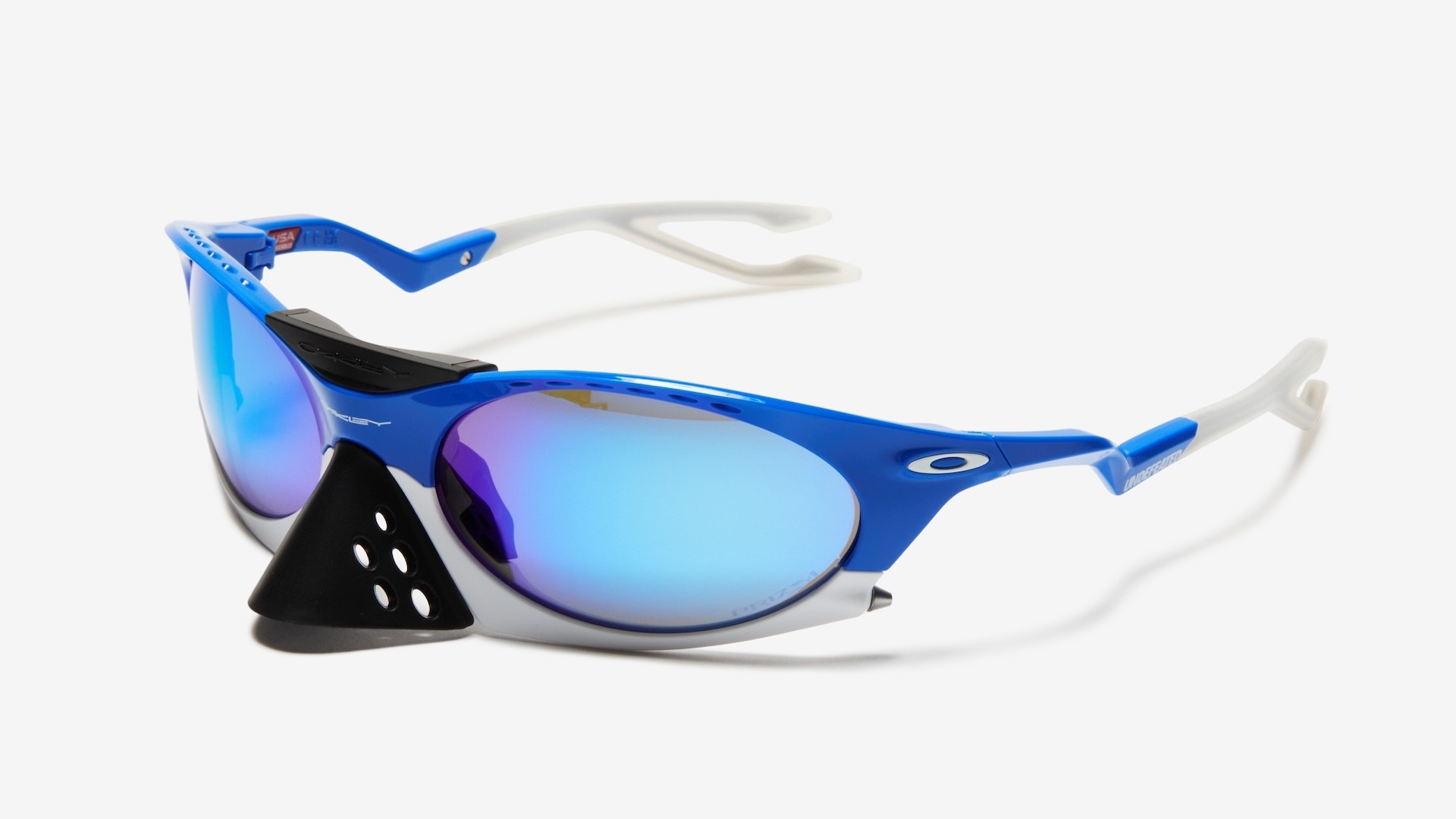 Blue and white Oakley sports sunglasses with mirrored lenses and a black nose shield.