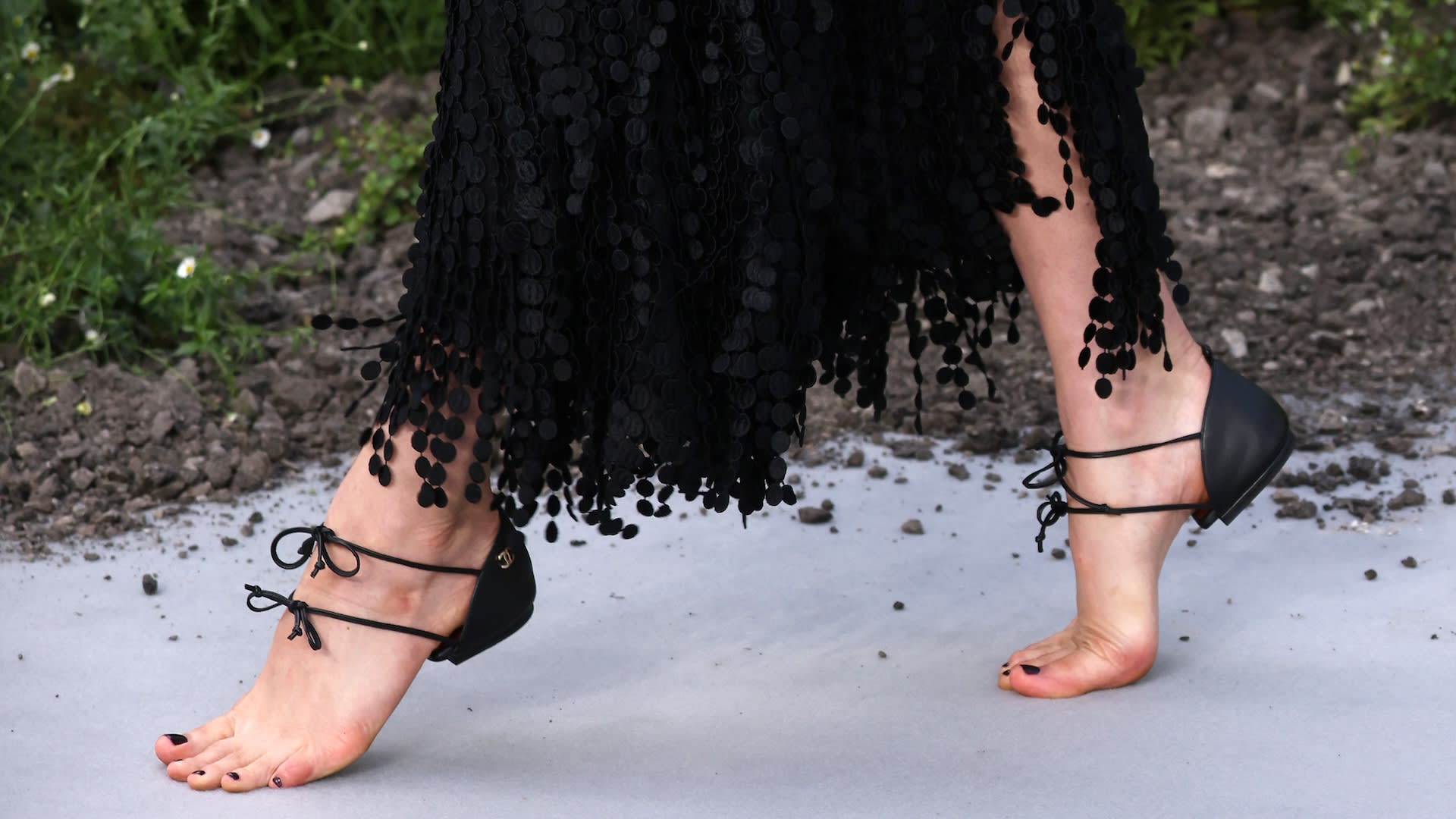 Margaret Qualley Debuts Chanel's Barefoot Heel-Cap Shoes in London