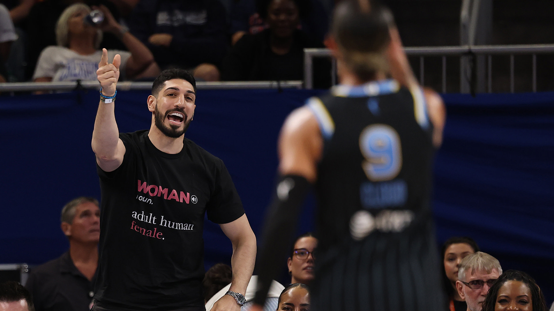 Former basketball player Enes Kanter Freedom and Natasha Cloud #9 of the Chicago Sky yell at one another during the second half between the Chicago Sky and the Indiana Fever at Wintrust Arena on August 23, 2026 in Chicago, Illinois. 