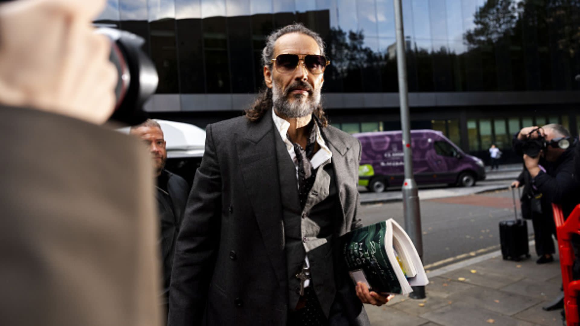 Russell Brand Labeled a 'Ruthless Predator' Ahead of Assault Trial