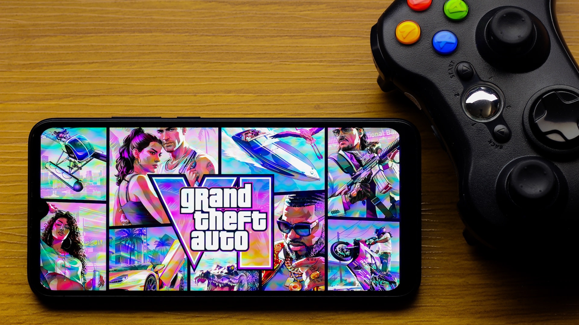 CANADA - 2026/10/12: In this photo illustration, the Grand Theft Auto VI (GTA 6) game logo is seen displayed on a smartphone screen next to an Xbox video game controller. 