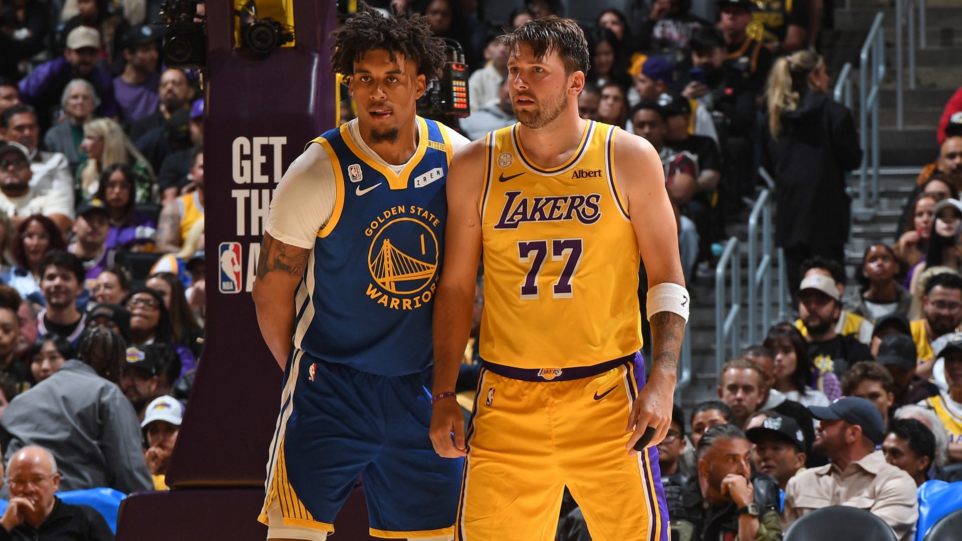 Yaxel Lendeborg #1 of the Golden State Warriors & Luka Doncic #77 of the Los Angeles Lakers looks on during the game on October 21, 2026 at Chase Center in San Francisco, California.