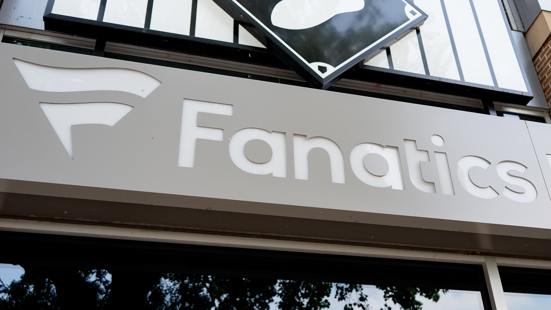Fanatics logo sign is seen on a store building in Chicago, Illinois, United States, on July 26, 2026. The sign displays the brand logotype of Fanatics, a sports apparel and merchandise retailer. 