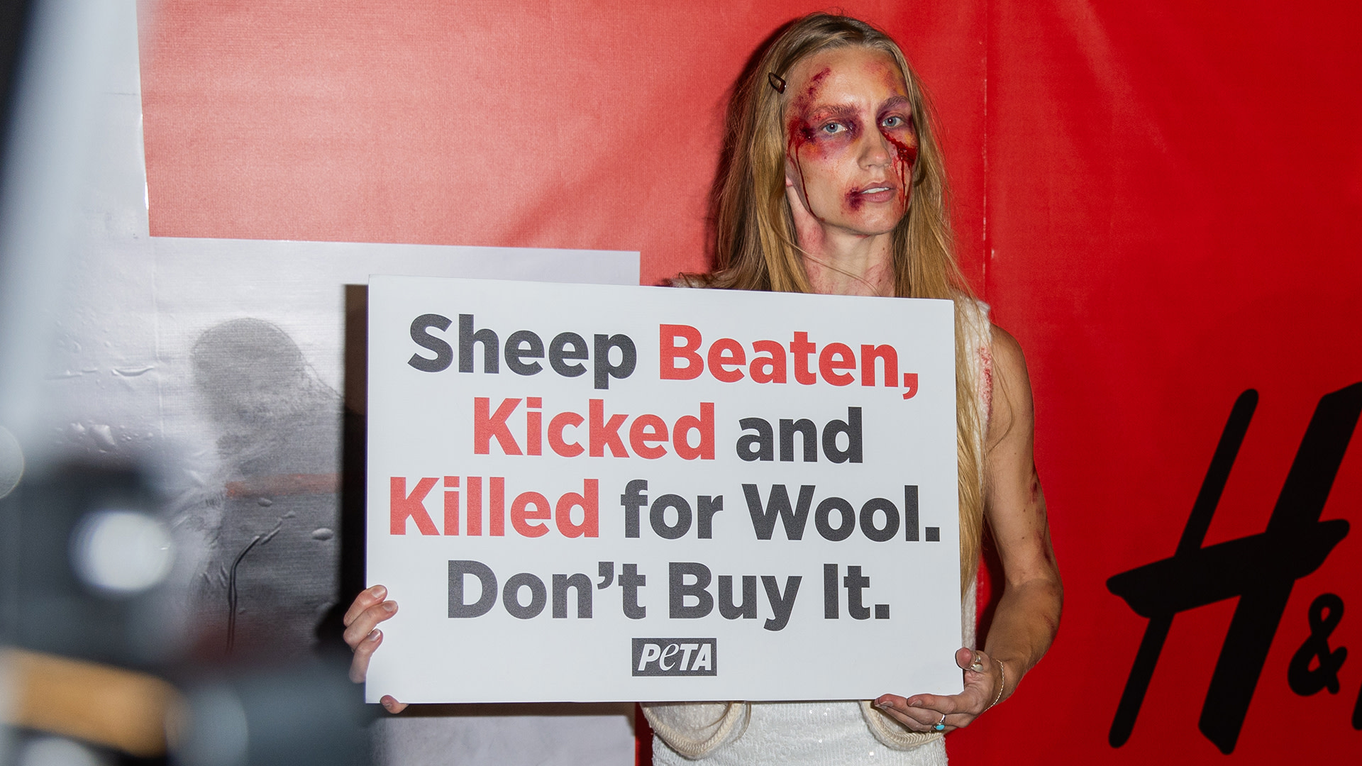 PETA models dressed in faux-wool clothing during a PETA protest outside the H&M London Fashion Week Show at Olympia London on September 17, 2026 in London, England. The animal rights group held the demonstration to protest against the high street chain's use of wool in their clothing. 