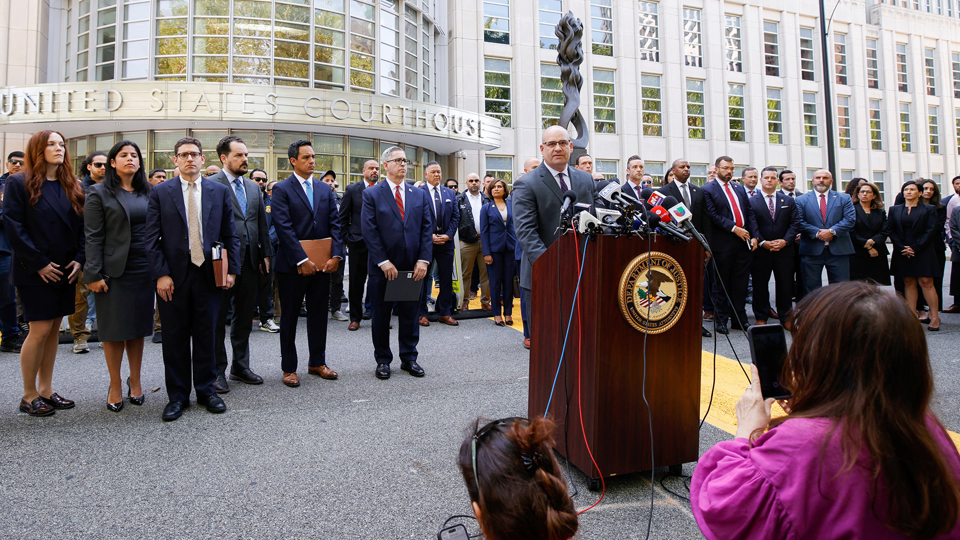 Andrew Tysen Duva (at lectern), US Assistant Attorney General of the Criminal Division, speaks to the press outside the federal courthouse in the Brooklyn borough of New York City on July 20, 2026, following the sentencing of Mexican drug lord Ismael "El Mayo" Zambada. 
