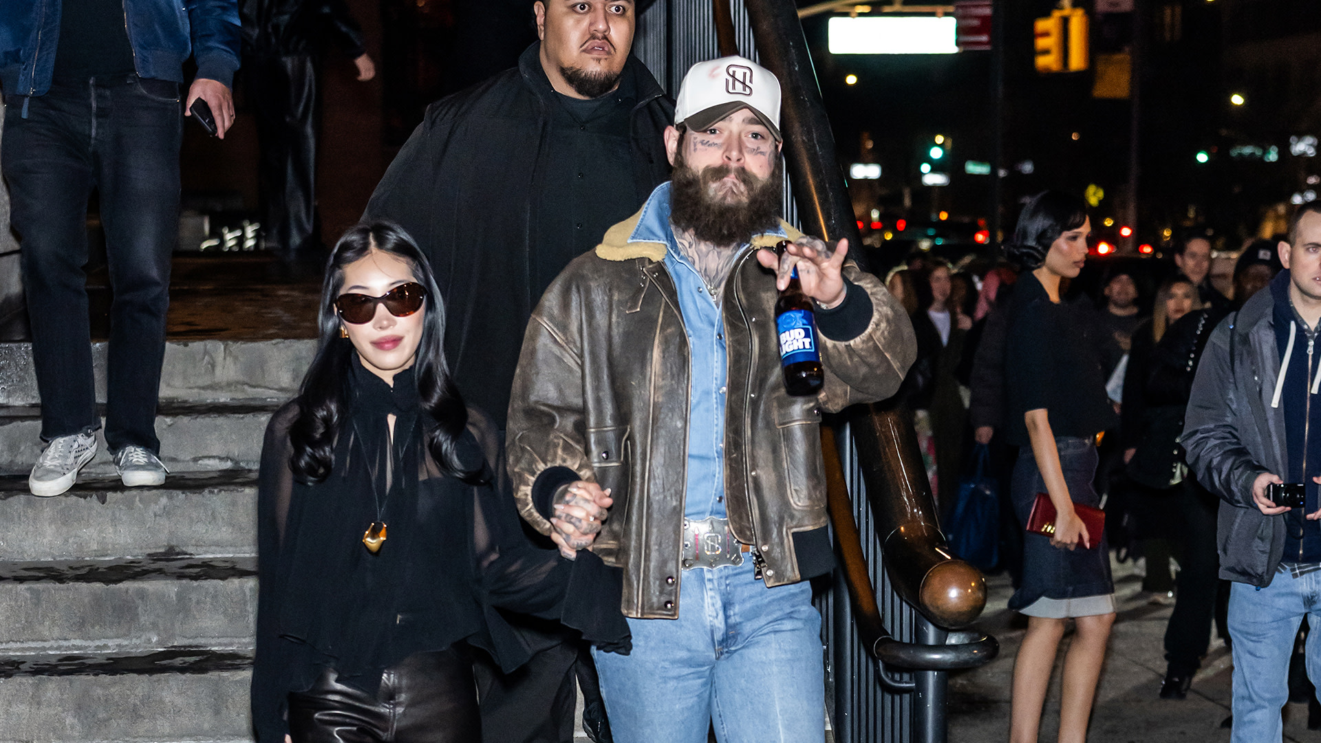 Post Malone (R) and girlfriend Christy Lee attend Khaite fashion show during New York Fashion Week at Park Avenue Armory on February 14, 2026 in New York City. 