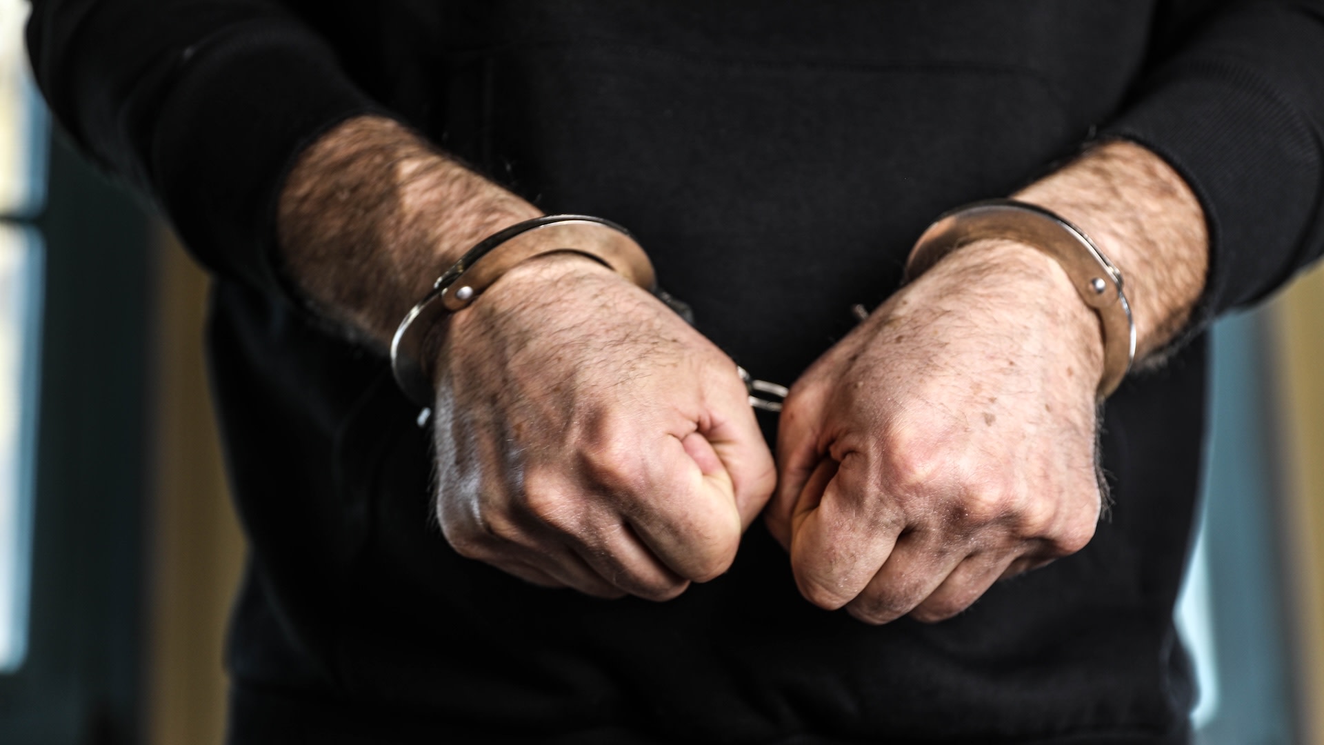 Man in handcuffs.