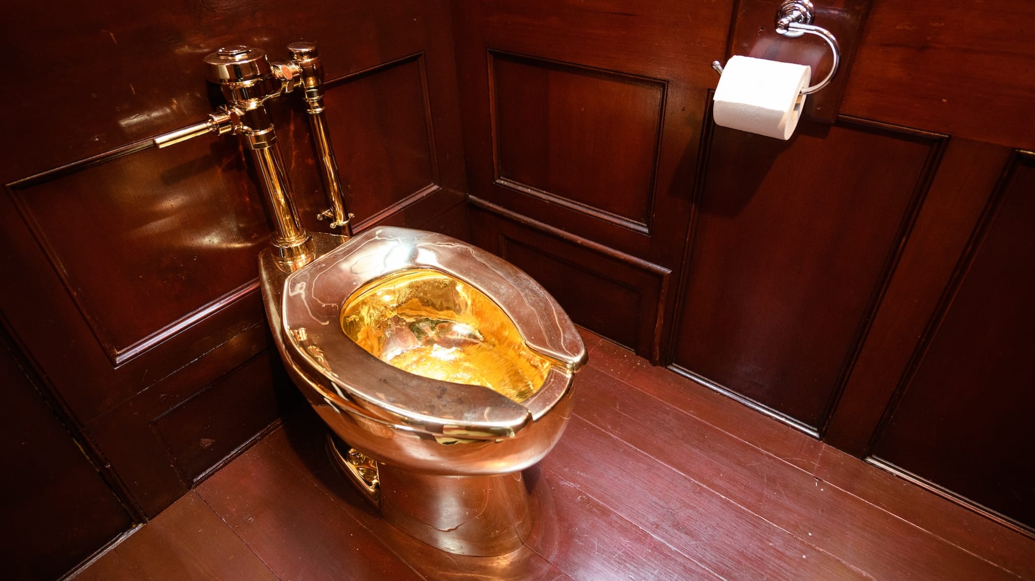 WOODSTOCK, ENGLAND - SEPTEMBER 12: "America", a fully-working solid gold toilet, created by Maurizio Cattelan, is seen at Benheim Palace on September 12, 2019 in Woodstock, England. The artwork is still missing following what police believe to be a burglary on September 14, in which the toilet, valued by some at £4.8million, was taken. In 1996, Cattelan famously stole the entire contents of one of his own exhibitions in Amsterdam but has strongly denied any involvement with this latest theft.