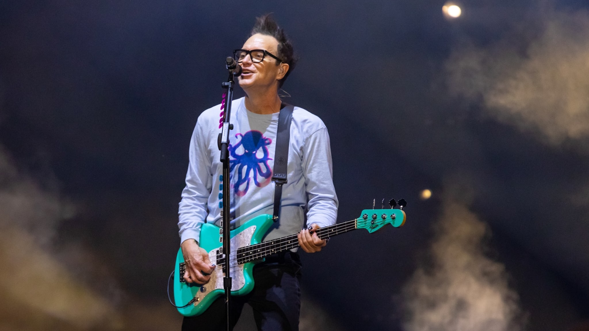 CHICAGO, ILLINOIS - AUGUST 04: Mark Hoppus of Blink-182 performs onstage during Lollapalooza at Grant Park on August 04, 2024 in Chicago, Illinois.