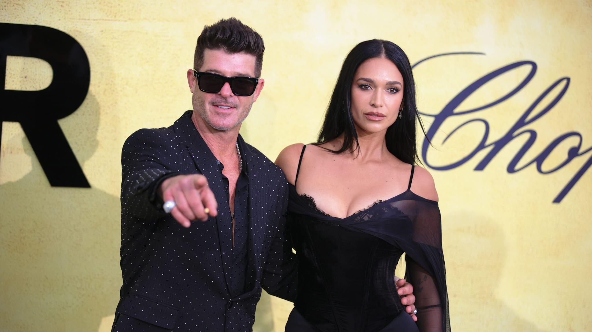 CAP D'ANTIBES, FRANCE - MAY 22: American singer Robin Thicke and April Love Geary arrive to the amfAR Gala Cannes during the 78th edition of the Cannes Film Festival in Antibes, France on May 22, 2025.