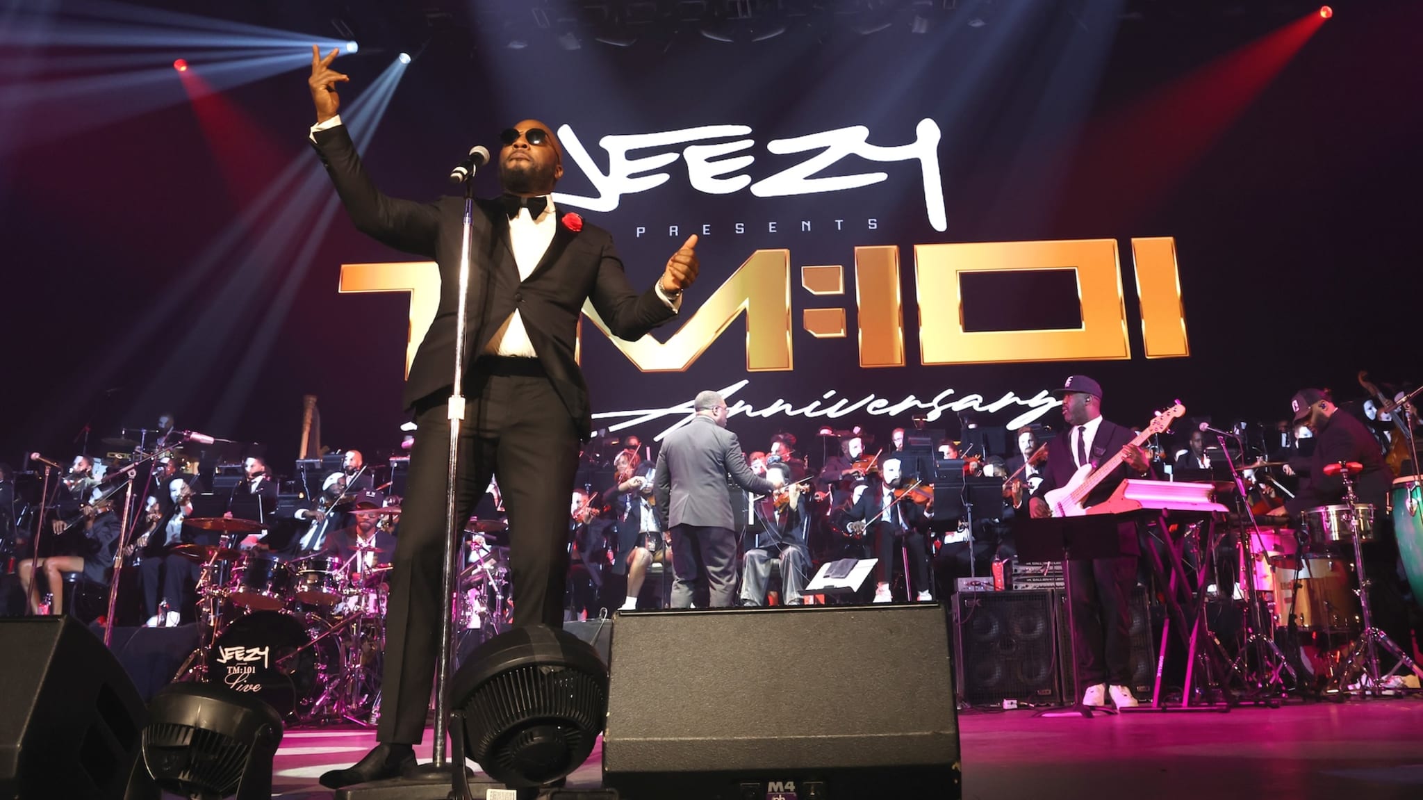LAS VEGAS, NEVADA - NOVEMBER 01: Jeezy (C) performs with The Color of Noize orchestra composed by Derrick Hodge during TM:101 Live - The Masquerade Las Vegas Residency at PH Live at Planet Hollywood Resort & Casino on November 01, 2025 in Las Vegas, Nevada.