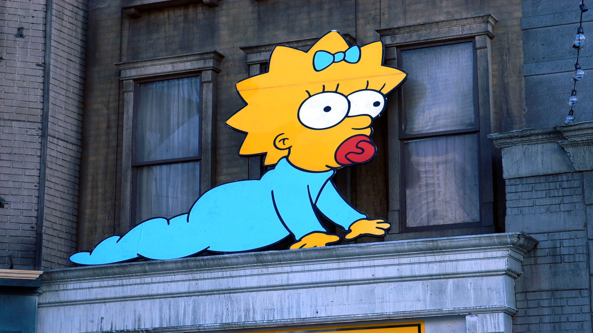 Maggie Simpson cut-out on building