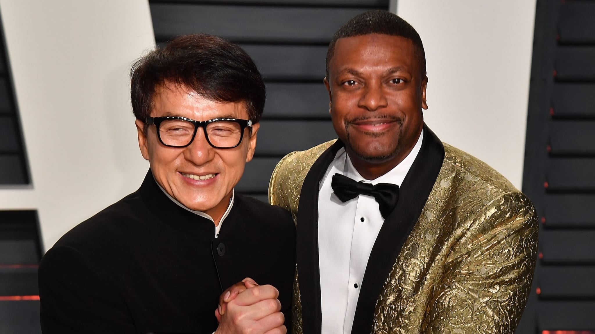 BEVERLY HILLS, CA - FEBRUARY 26: Jackie Chan and Chris Tucker attend the 2017 Vanity Fair Oscar Party Hosted by Graydon Carter at the Wallis Annenberg Center for the Performing Arts on February 26, 2017 in Beverly Hills, California.
