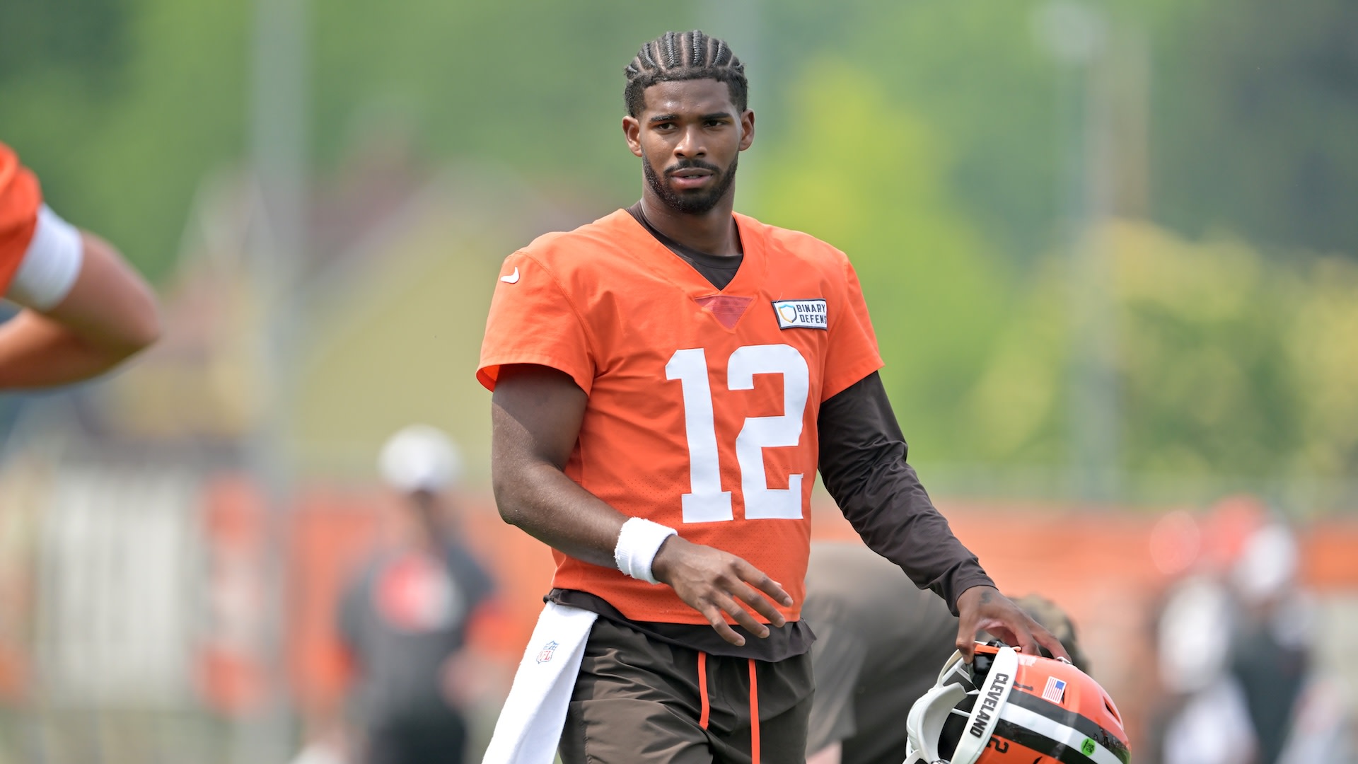 BEREA, OHIO - JUNE 12: Quarterback Shedeur Sanders #12 of the Cleveland Browns watches practice during organized team activities at CrossCountry Mortgage Campus on June 12, 2025 in Berea, Ohio.