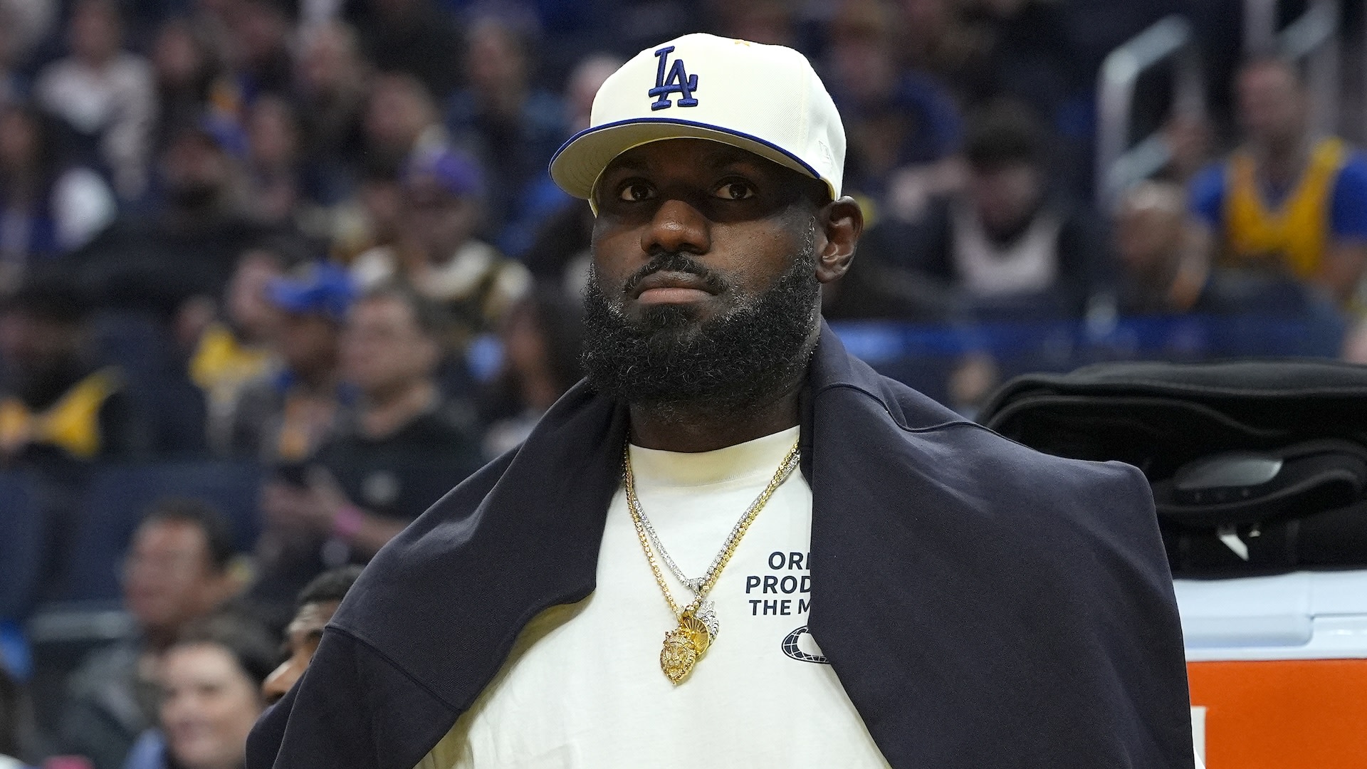 Lebron James #23 of the Los Angeles Lakers looks on from the bench against the Golden State Warriors in the first half of a preseason NBA game at Chase Center on October 05, 2025 in San Francisco, California. NOTE TO USER: User expressly acknowledges and agrees that, by downloading and or using this photograph, User is consenting to the terms and conditions of the Getty Images License Agreement.