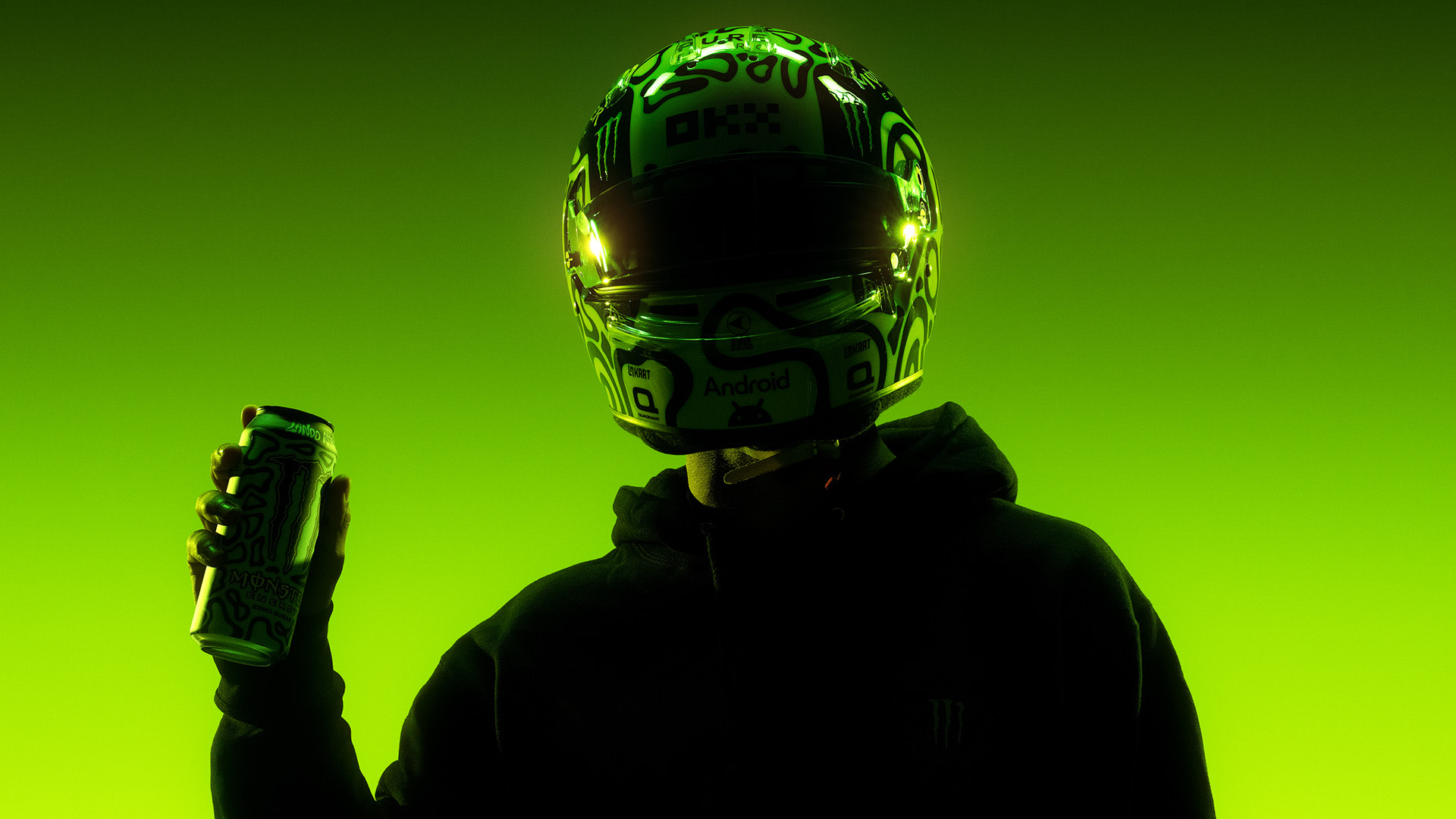 Silhouetted person in a helmet holding a can, set against a green background.
