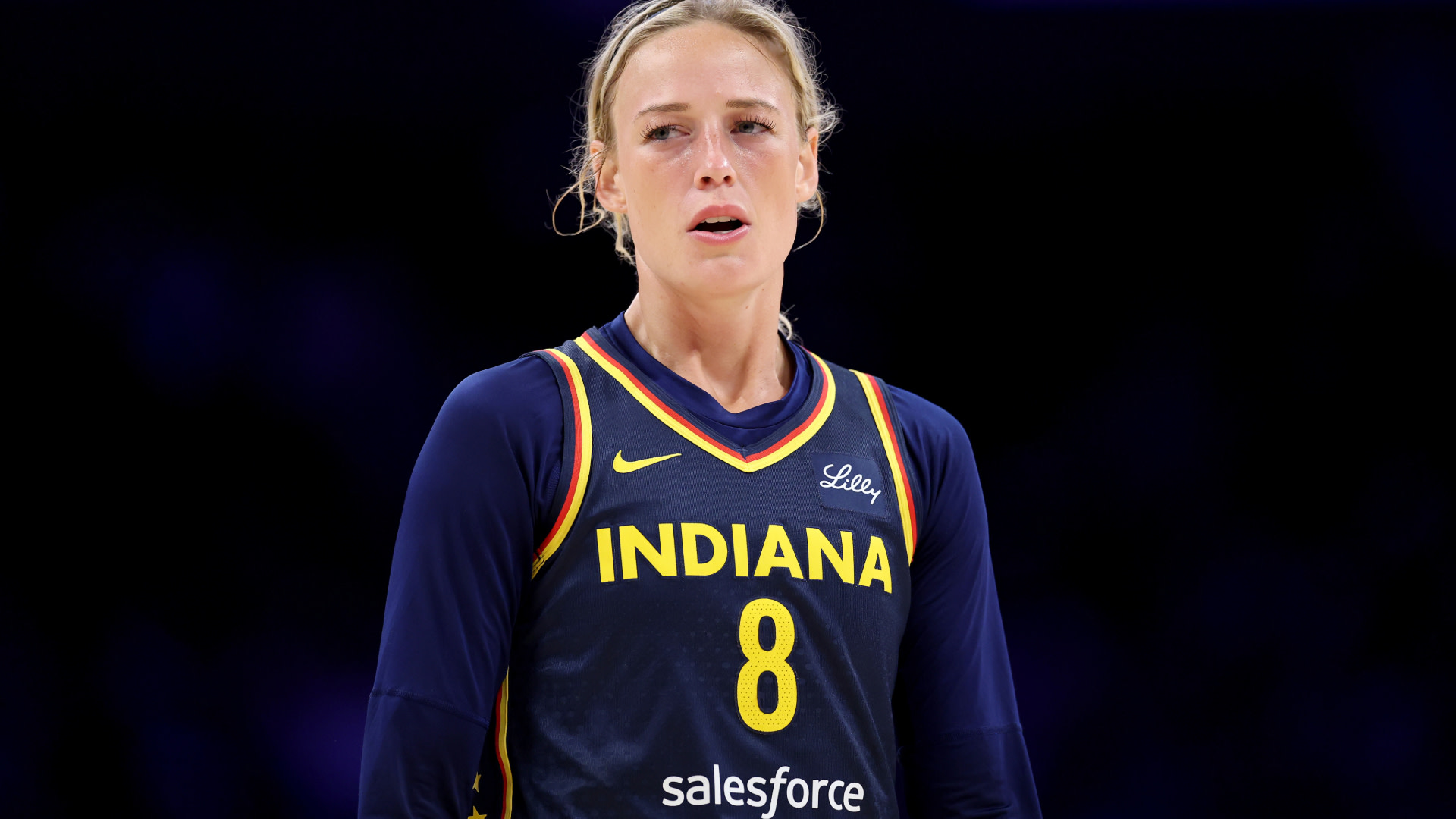 Sophie Cunningham, in an Indiana jersey with the number 8, standing on the court.