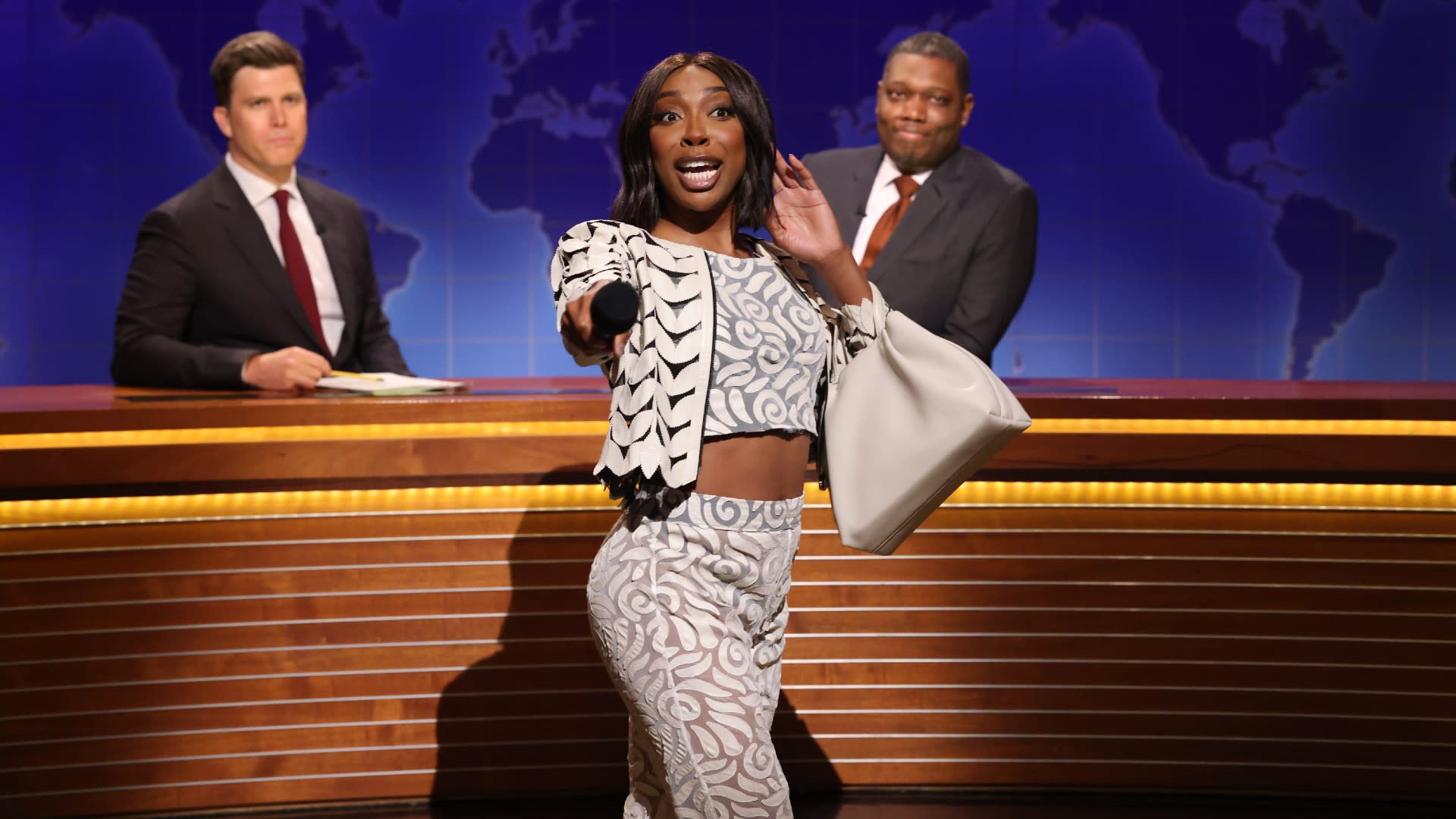 Anchor Colin Jost, Ego Nwodim as Miss Eggy, and anchor Michael Che during Weekend Update on Saturday, May 17, 2025 