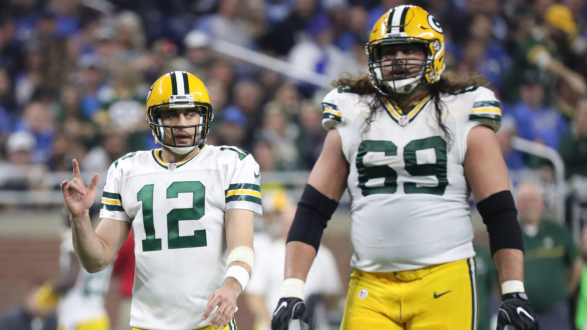 Aaron Rodgers and David Bakhtiari of the Green Bay Packers walk to the line during the second quarter of the game.