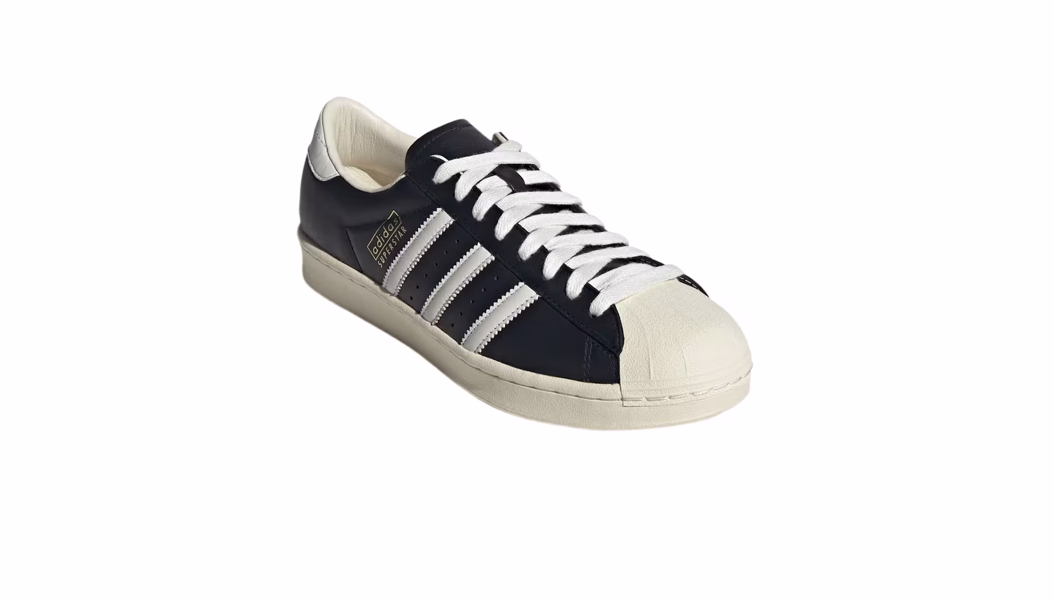 A black and white Adidas Superstar sneaker with three white stripes and a shell toe design.